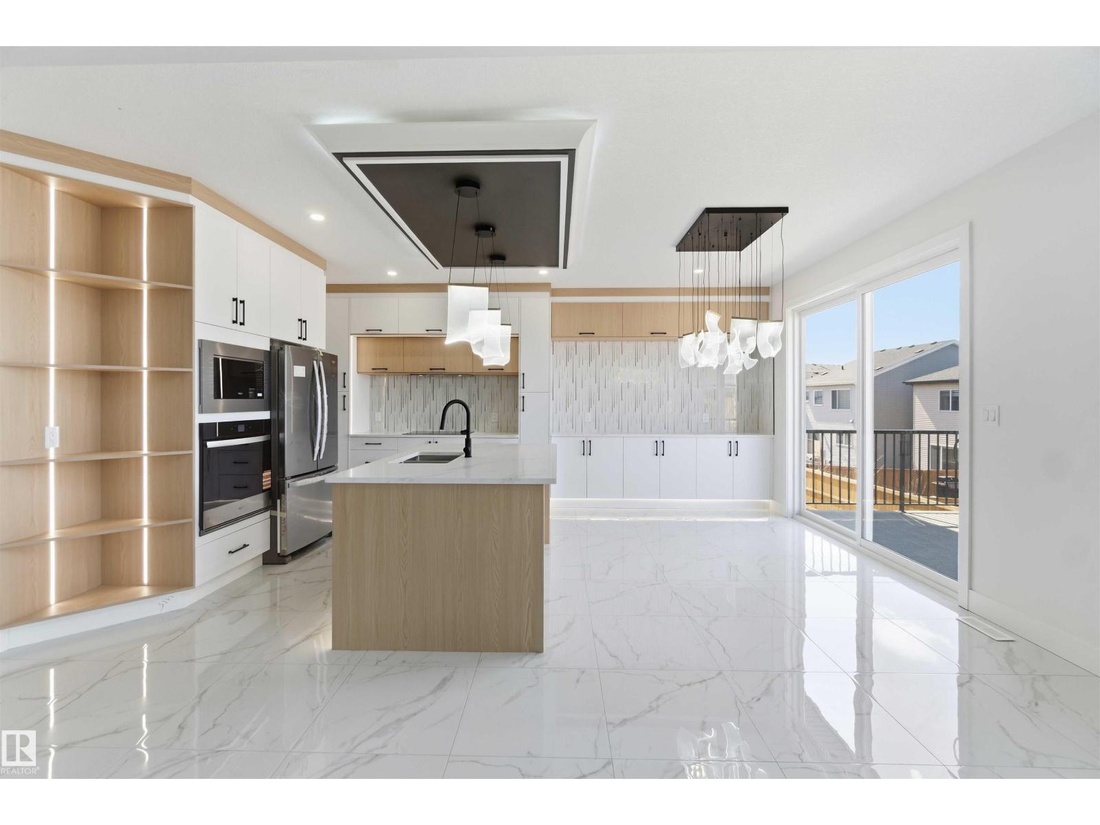 Kitchen with sliding door to backyard
